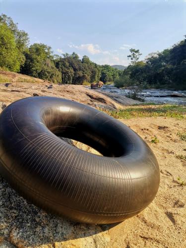 a large black tube laying on the ground at Lions Rock Rapids - Luxury Tented Camp in Hazyview