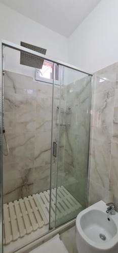 a bathroom with a shower and a toilet and a sink at Farah’s house in Padova