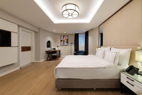 TV a/nebo společenská místnost v ubytování Gleam Collection Hotel