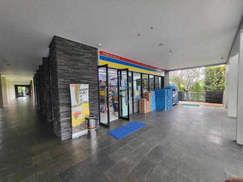 a room with a building with a brick wall at Villa Vimala Hills Semeru in Bogor