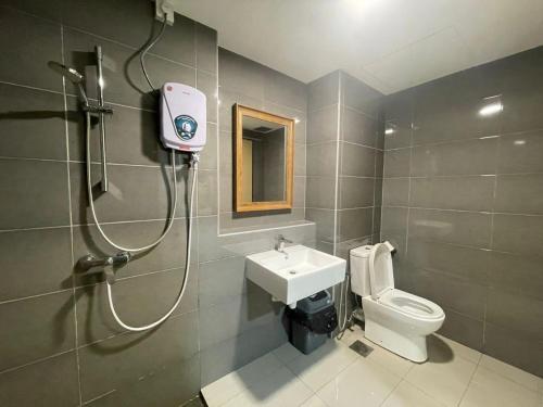 a bathroom with a shower and a toilet and a sink at Imperium Residence Kuantan Level 12 in Kuantan