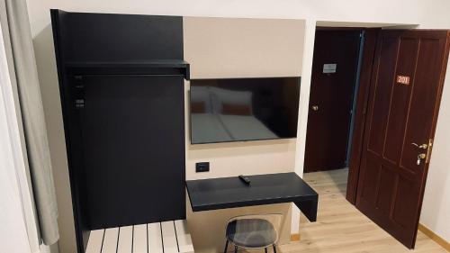 a bathroom with a black sink and a mirror at House of Bruno - NO Reception in Trento