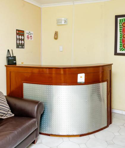 a waiting room with a couch and a counter at Nkosazana Guest House in Durban