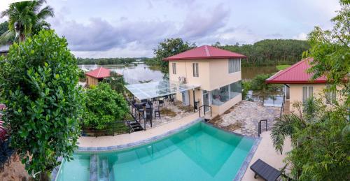 an aerial view of a house with a swimming pool at Savenndra Resorts in Malwana