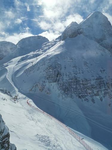 a snow covered mountain with a ski slope on it at Country house Dovje in Dovje