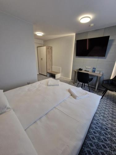 Una cama o camas en una habitación de Hotel Gordon