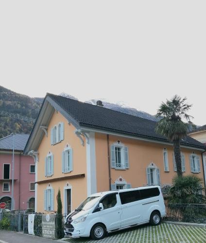 a white van parked in front of a house at CASA BELGERI - Bed & Breakfast in Dongio