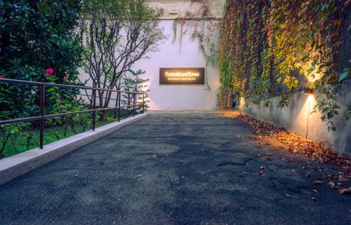 an empty street with a sign on the side of a building at TURINHOMETOWN Residence Apartments in Turin