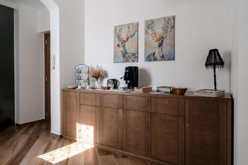 a large wooden cabinet in a living room at La Valle in Agerola