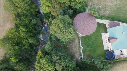 an overhead view of a patio with a purple umbrella at Family SPA Apartments Sunny&Shiny in Šavnik