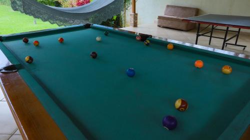 a pool table with balls on top of it at Condo's Vista Al Volcan in Fortuna