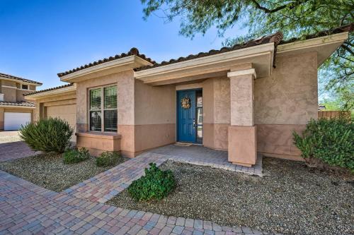 a house with a blue door in a yard at Walk to Community Pool Goodyear Desert Oasis in Goodyear