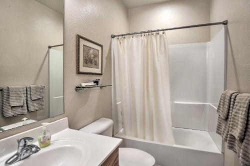 a bathroom with a sink and a toilet and a shower at Walk to Community Pool Goodyear Desert Oasis in Goodyear