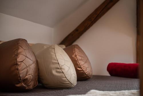 three pillows sitting on the floor in a room at LTE Apartments in Maribor