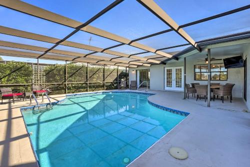an indoor swimming pool with a retractable roof at Waterfront Port Richey House with Heated Pool! in Port Richey
