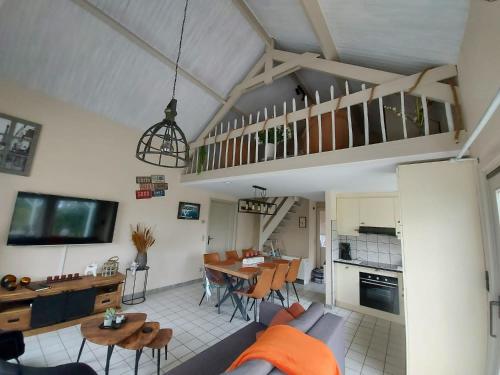 a living room with a couch and a table at The Beach House in Middelkerke