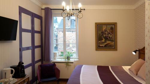 Voodi või voodid majutusasutuse Au Chapitre toas