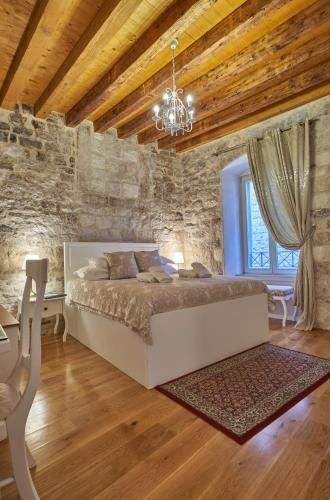 Letto o letti in una camera di Villa Split Heritage Hotel