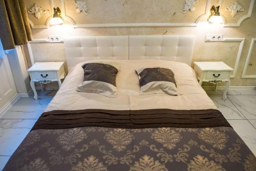 Кровать или кровати в номере Exclusive Apartmanok Szeged