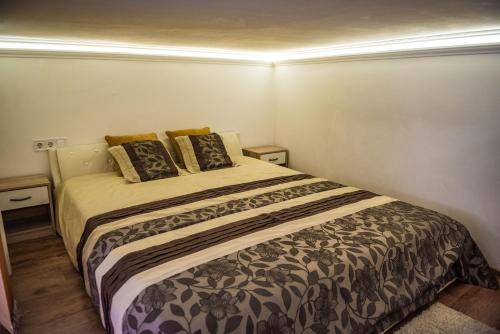 Кровать или кровати в номере Exclusive Apartmanok Szeged