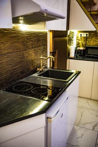 Кухня или мини-кухня в Exclusive Apartmanok Szeged
