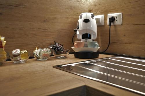 Coffee and tea making facilities at DIZETA Suite and Apartment