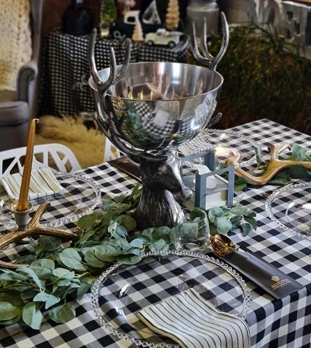a table with a silver bowl on a checkered table cloth at Silverton -sauna,jacuzzi,mini siłownia,bar sezonowy, przyjazny rodzinom in Białka Tatrzanska
