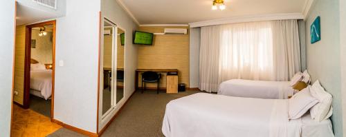 Una cama o camas en una habitación de Gran Hotel Verona