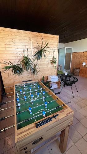 a table with a soccer game on top of it at Horská bouda KUPROVKA in Strážné