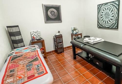 a room with a bed and a table in it at The Marbella Heights Boutique Hotel in Marbella