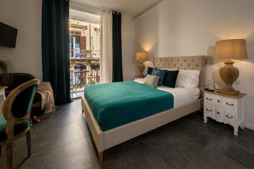Letto o letti in una camera di Palazzo Natoli Boutique Hotel