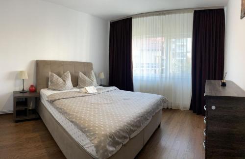 Ένα ή περισσότερα κρεβάτια σε δωμάτιο στο Cozy Loft