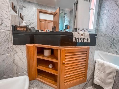 a bathroom with a sink and a mirror at The Marbella Heights Boutique Hotel in Marbella