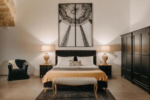 Letto o letti in una camera di Palazzo Natoli Boutique Hotel