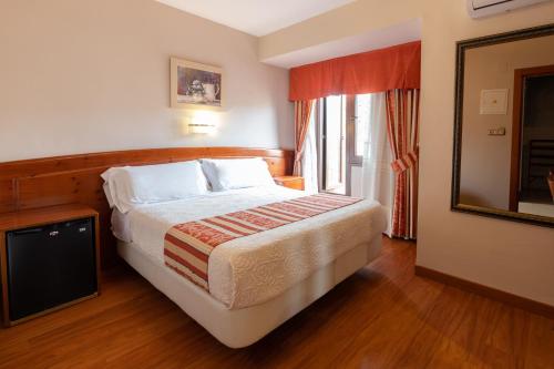 Hotel Alameda Málagaにあるベッド