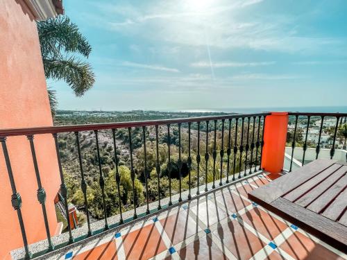 a balcony with a bench and a view at The Marbella Heights Boutique Hotel in Marbella