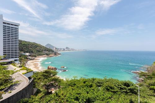 a view of the ocean from a building at Beach Loft next to the Sheraton Leblon in Rio de Janeiro