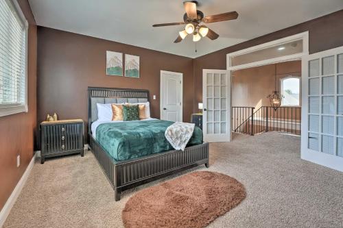 a bedroom with a bed and a ceiling fan at Cordova Home with Pool Table, 17 Mi to Memphis Zoo! in Cordova