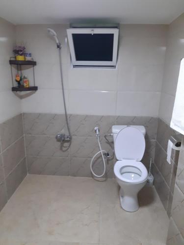 a bathroom with a toilet and a shower at بيت الطبيعة nature house in Jerash