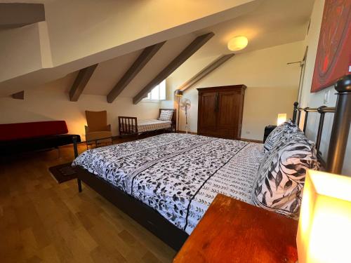a bedroom with a large bed in a room at Large villa for 20 guests on large estate with private pool and tennis court Big conference room with facilities VILLAITALY EU in Cairo Montenotte