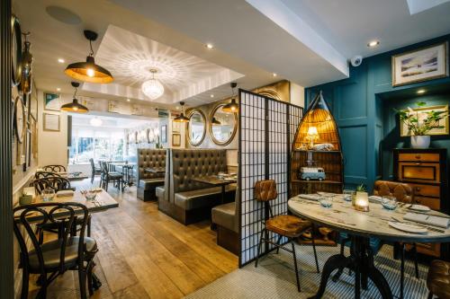a dining room with a table and chairs at 1863 Restaurant with Rooms in Pooley Bridge