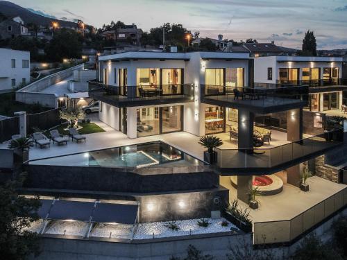 an aerial view of a house with a swimming pool at Villa Platinium in Opatija