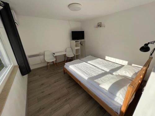 Ένα ή περισσότερα κρεβάτια σε δωμάτιο στο Pixel Guesthouse