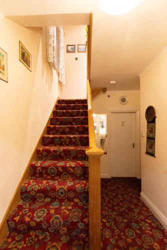 a staircase in a room with a stair case at Quince House in Oxford