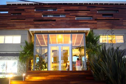 a house with a glass door in front of it at Casa Bikini in Punta del Este