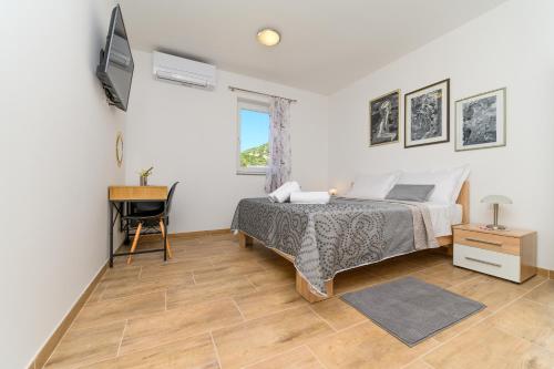 Ένα ή περισσότερα κρεβάτια σε δωμάτιο στο Rooms FOREVER