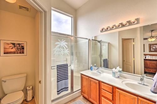 a bathroom with a toilet and a sink and a shower at Radiant Peoria Paradise House with Pool and Patio! in Peoria