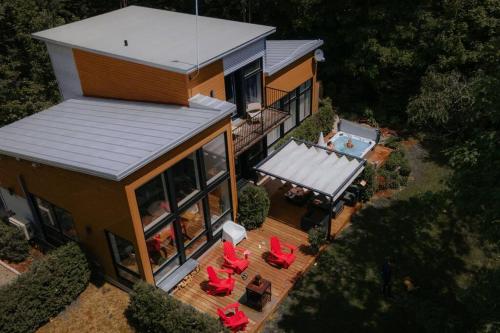 an aerial view of a house with a swimming pool at Chalet Villa Bianca Spa in Sainte Béatrix