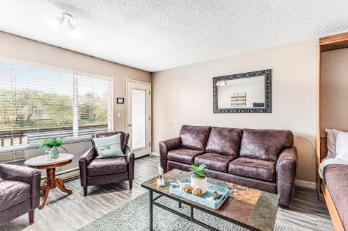 a living room with a couch and chairs and a table at Proposal Rock View in Neskowin