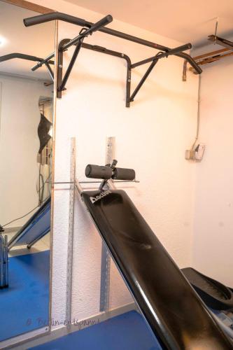 a gym with a slide in a room at Berlin entspannt geniessen in Berlin